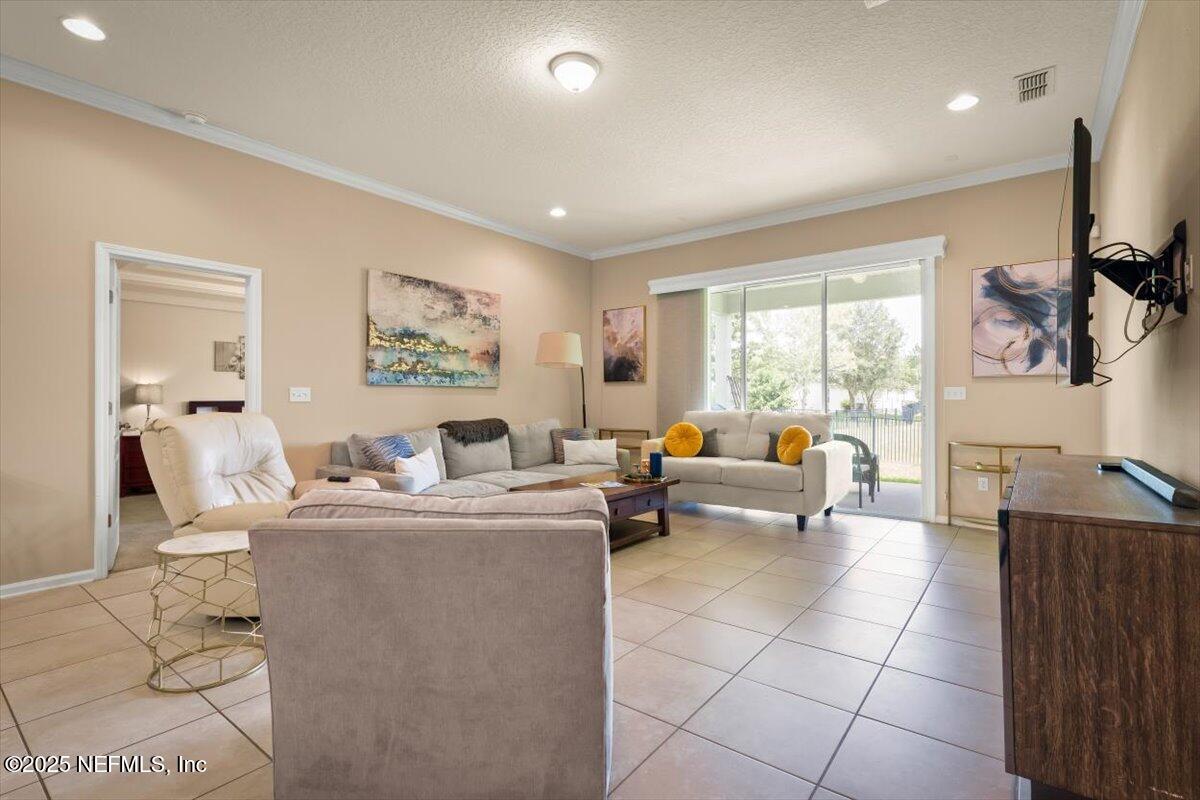 486 Porta Rosa Circle St. Augustine, FL 32092 - Photo 9 of 38 a living room with furniture and a large window