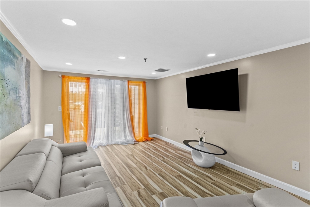 45 Christopher Drive, Unit 93 Methuen, MA 01844 - Photo 11 of 37 a bedroom with a bed and a flat screen tv