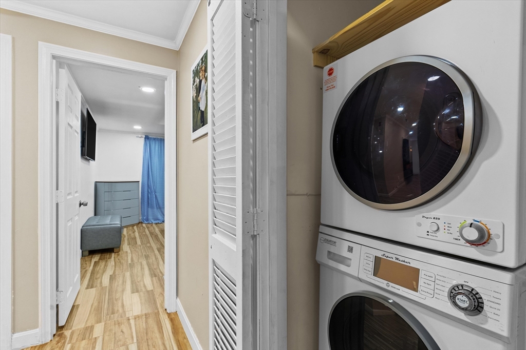 45 Christopher Drive, Unit 93 Methuen, MA 01844 - Photo 16 of 37 a view of a hallway with washer and dryer