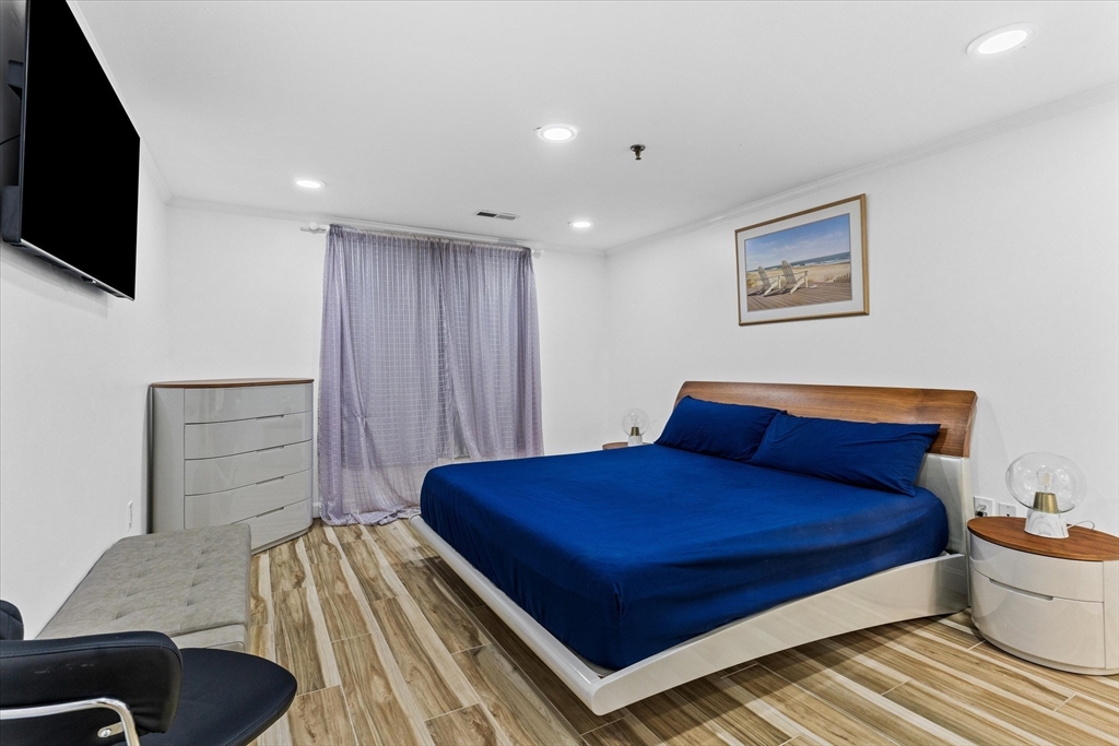 45 Christopher Drive, Unit 93 Methuen, MA 01844 - Photo 18 of 37 a bedroom with a bed and a television