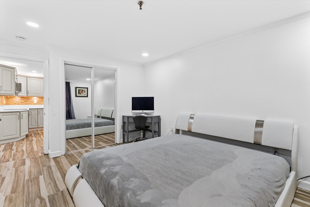 45 Christopher Drive, Unit 93 Methuen, MA 01844 - Photo 21 of 37 a bedroom with a bed and a flat screen tv