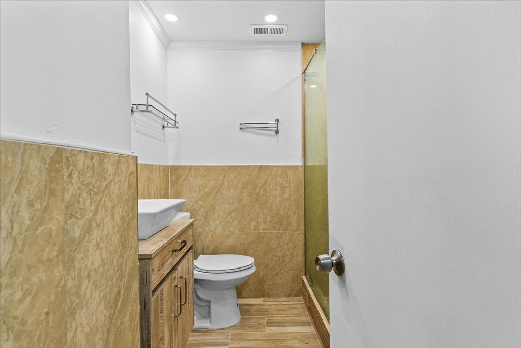 45 Christopher Drive, Unit 93 Methuen, MA 01844 - Photo 23 of 37 a white toilet sitting next to a shower curtain