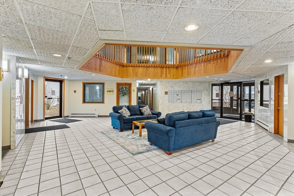 45 Christopher Drive, Unit 93 Methuen, MA 01844 - Photo 26 of 37 a living room with furniture