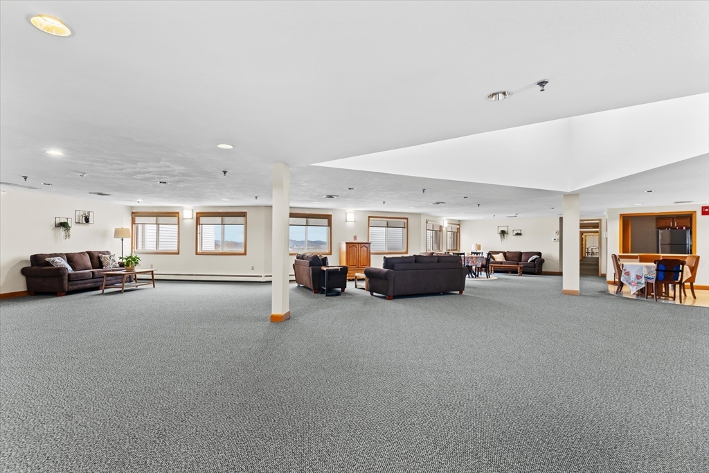 45 Christopher Drive, Unit 93 Methuen, MA 01844 - Photo 27 of 37 a living room with furniture and a window