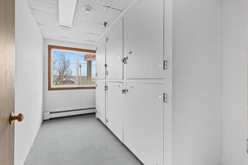 45 Christopher Drive, Unit 93 Methuen, MA 01844 - Photo 31 of 37 a view of a hallway with a white walls