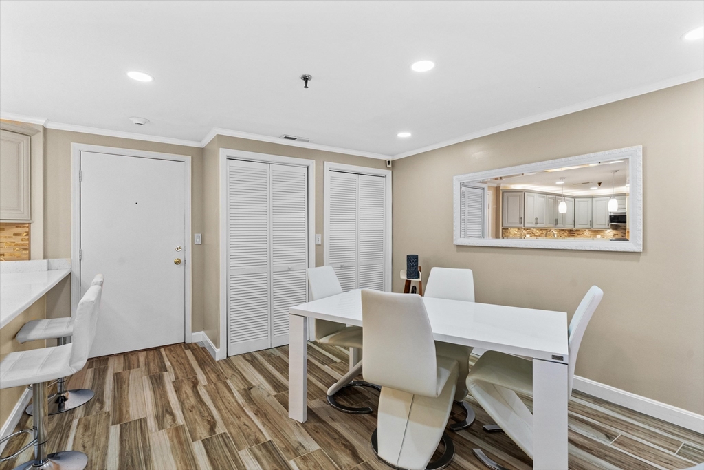45 Christopher Drive, Unit 93 Methuen, MA 01844 - Photo 5 of 37 a view of a dining room with furniture a rug and wooden floor