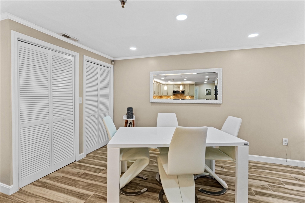 45 Christopher Drive, Unit 93 Methuen, MA 01844 - Photo 6 of 37 a view of a dining room with furniture and wooden floor