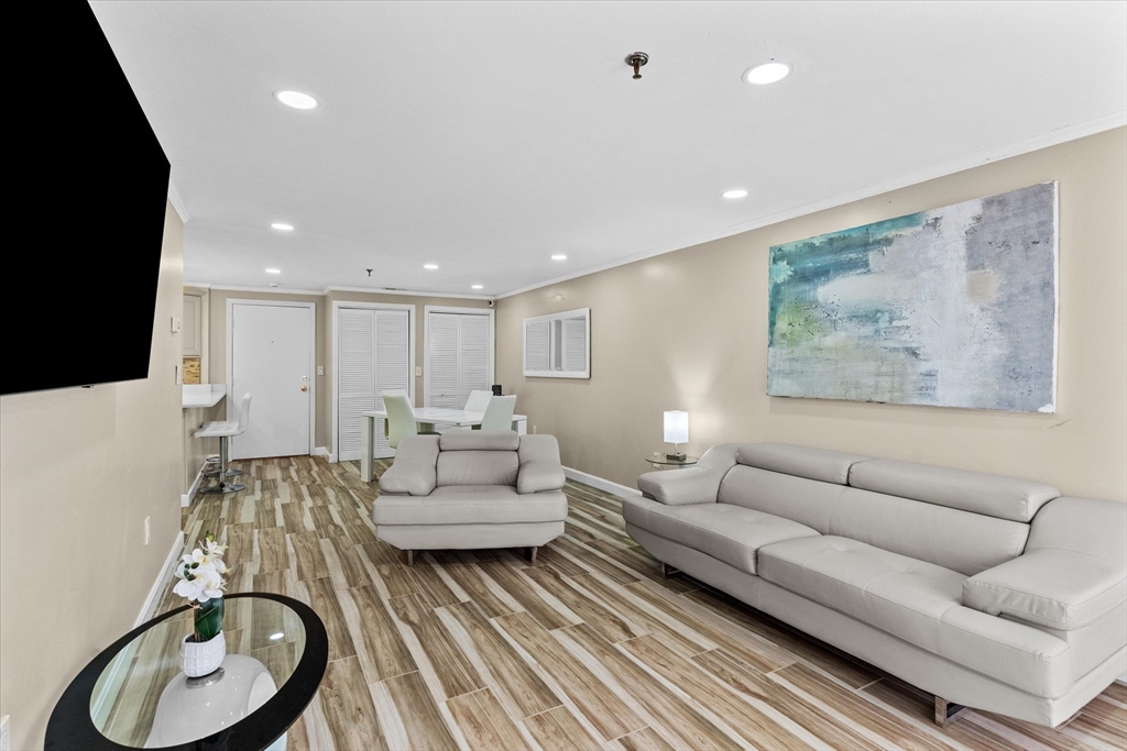 45 Christopher Drive, Unit 93 Methuen, MA 01844 - Photo 10 of 37 a living room with furniture a rug and white walls