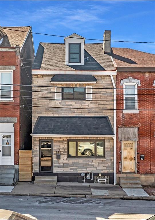 a front view of a house with a garage