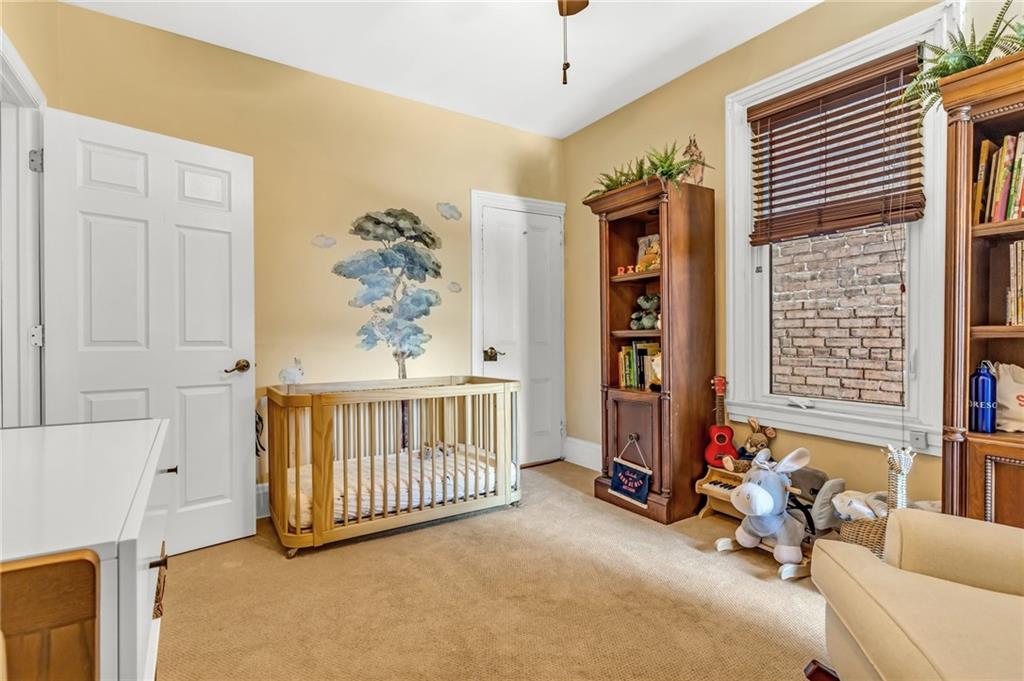 164 37th Street Pittsburgh, PA 15201 - Photo 12 of 24 a bedroom with furniture and a window