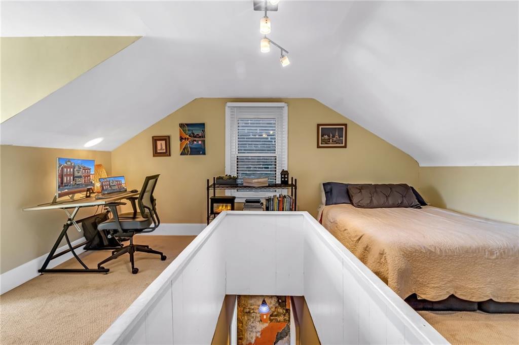 164 37th Street Pittsburgh, PA 15201 - Photo 14 of 24 a living room with furniture and a flat screen tv