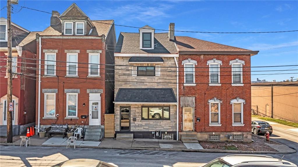 164 37th Street Pittsburgh, PA 15201 - Photo 23 of 24 a front view of a residential apartment building with a yard