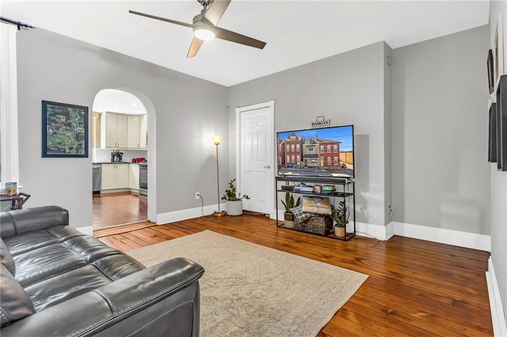 164 37th Street Pittsburgh, PA 15201 - Photo 5 of 24 a living room with furniture and a flat screen tv