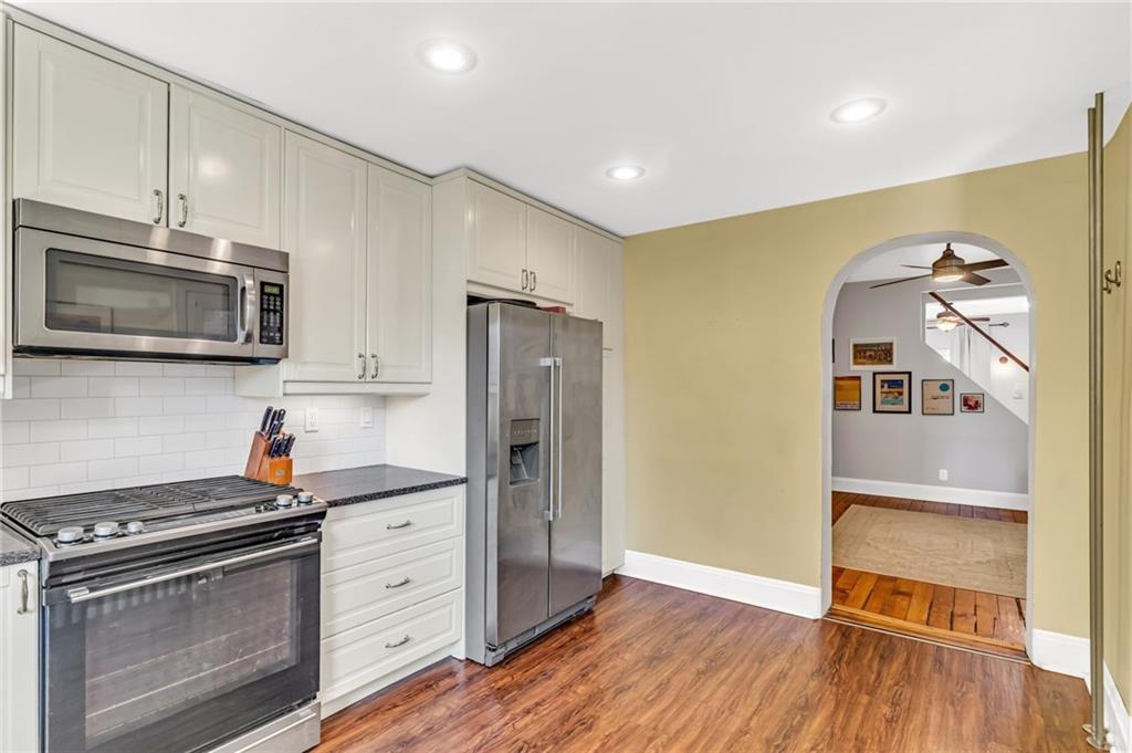 164 37th Street Pittsburgh, PA 15201 - Photo 7 of 24 a kitchen with stainless steel appliances a stove microwave and refrigerator