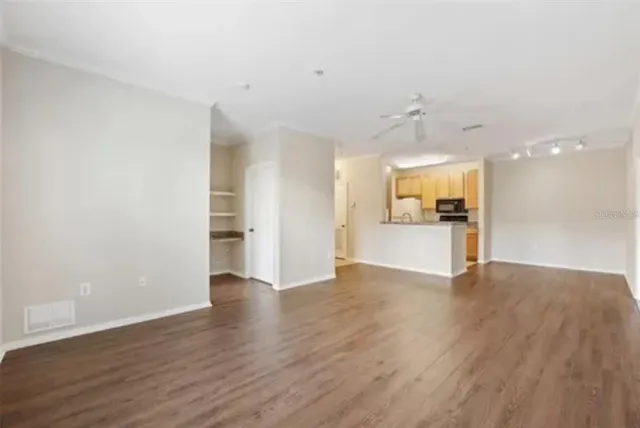 a view of a kitchen with a sink and a stove top oven
