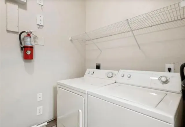 a utility room with dryer and washer