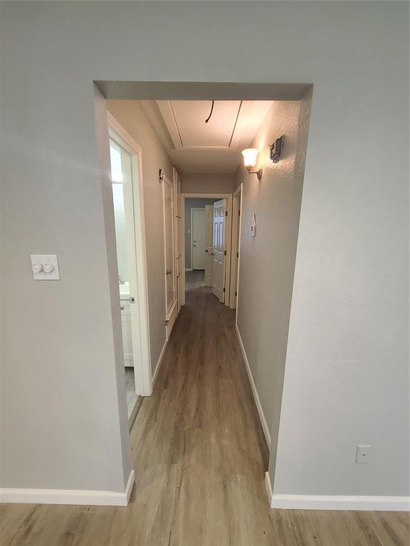 343 Spring Branch Lane Kennedale, TX 76060 - Photo 15 of 39 a view of a hallway with wooden floor and staircase