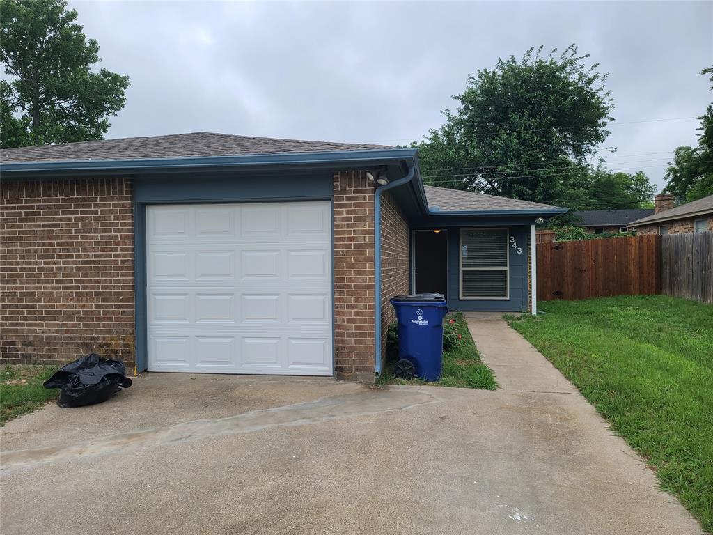 343 Spring Branch Lane Kennedale, TX 76060 - Photo 2 of 39 a front view of a house with a yard and garage