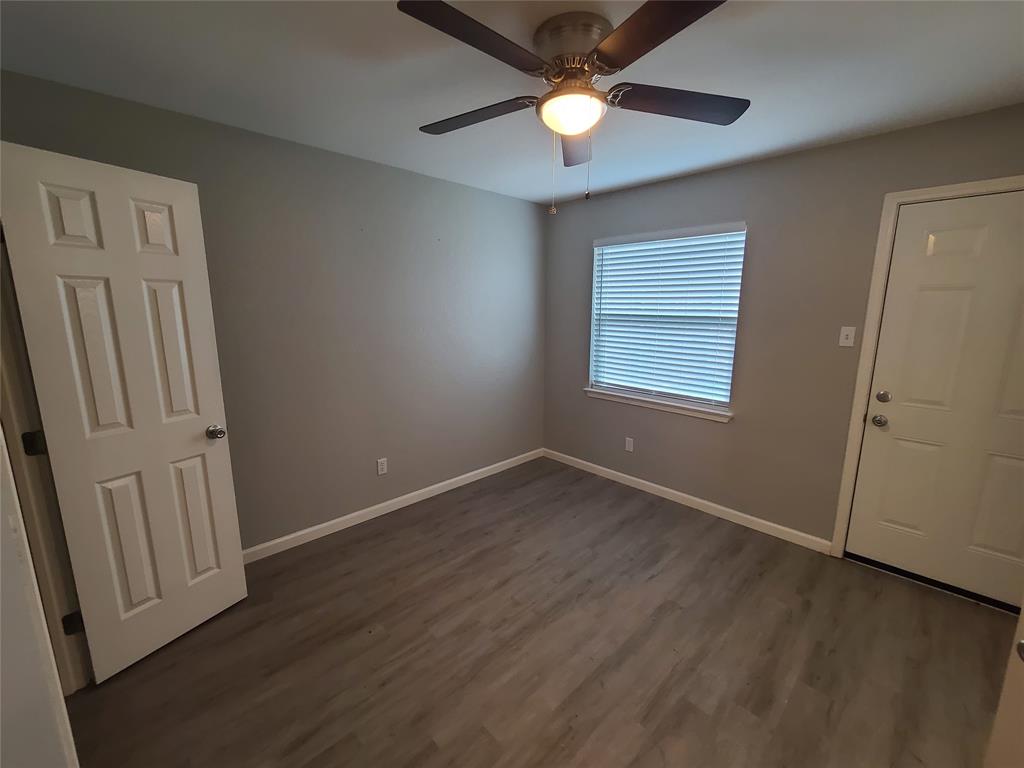 343 Spring Branch Lane Kennedale, TX 76060 - Photo 24 of 39 an empty room with wooden floor and window