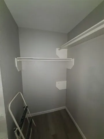 a view of storage and utility room with racks on the wall