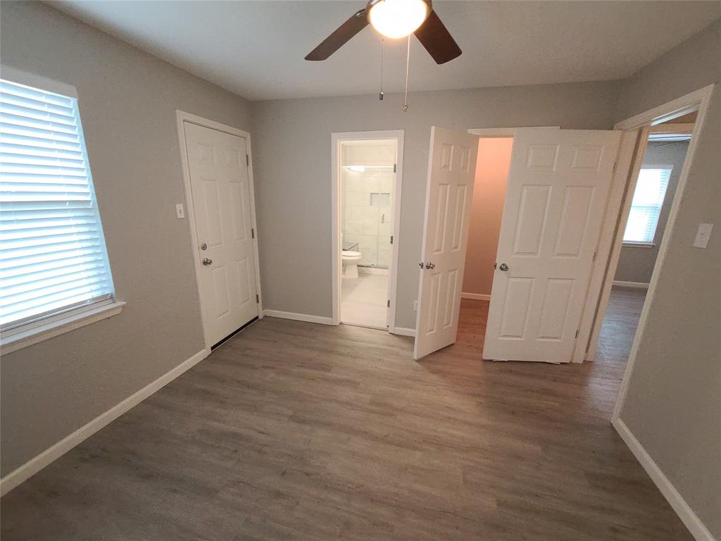 343 Spring Branch Lane Kennedale, TX 76060 - Photo 26 of 39 an empty room with wooden floor and windows