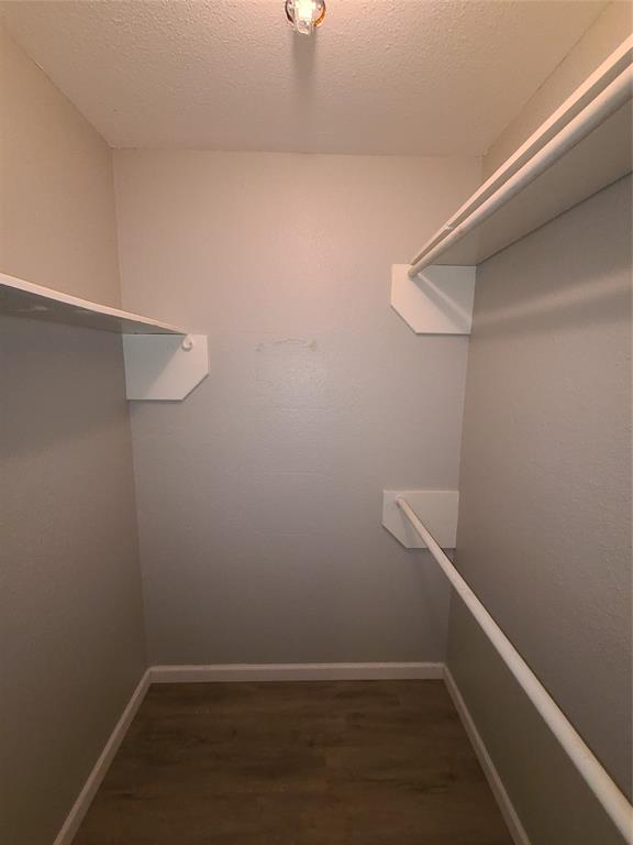 343 Spring Branch Lane Kennedale, TX 76060 - Photo 27 of 39 a view of an empty walk in closet