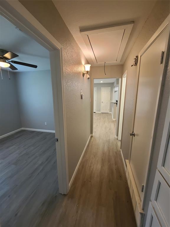 343 Spring Branch Lane Kennedale, TX 76060 - Photo 36 of 39 a view of a hallway with wooden floor