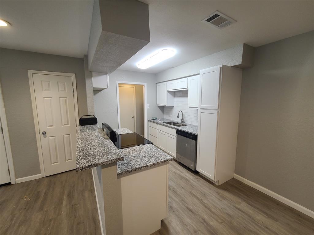 343 Spring Branch Lane Kennedale, TX 76060 - Photo 7 of 39 a kitchen with a sink stove and refrigerator