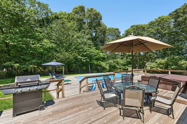 a patio with a patio table and chairs