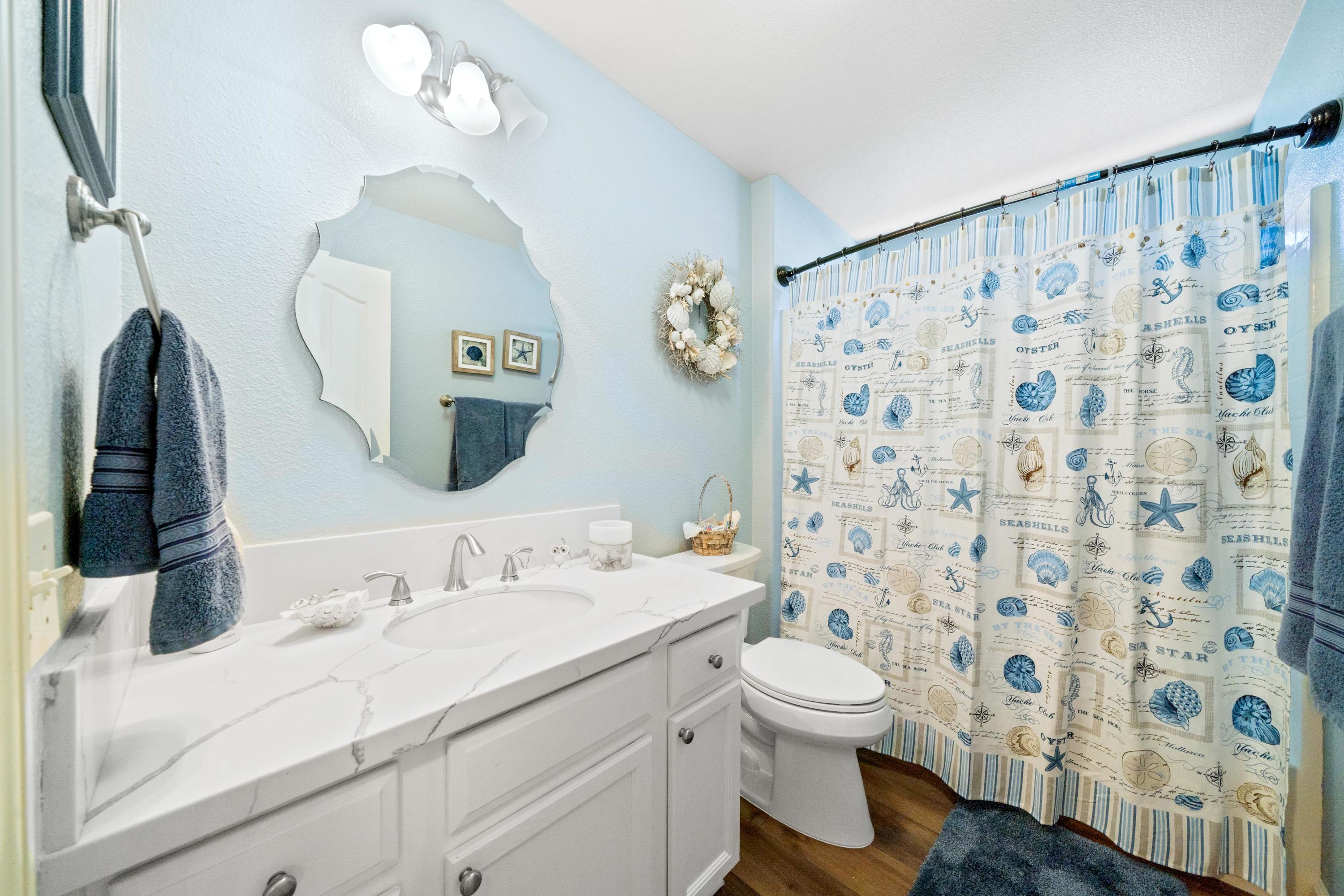 775 Stonebriar Trail Redding, CA 96003 - Photo 11 of 32 a bathroom with a sink a toilet and a mirror