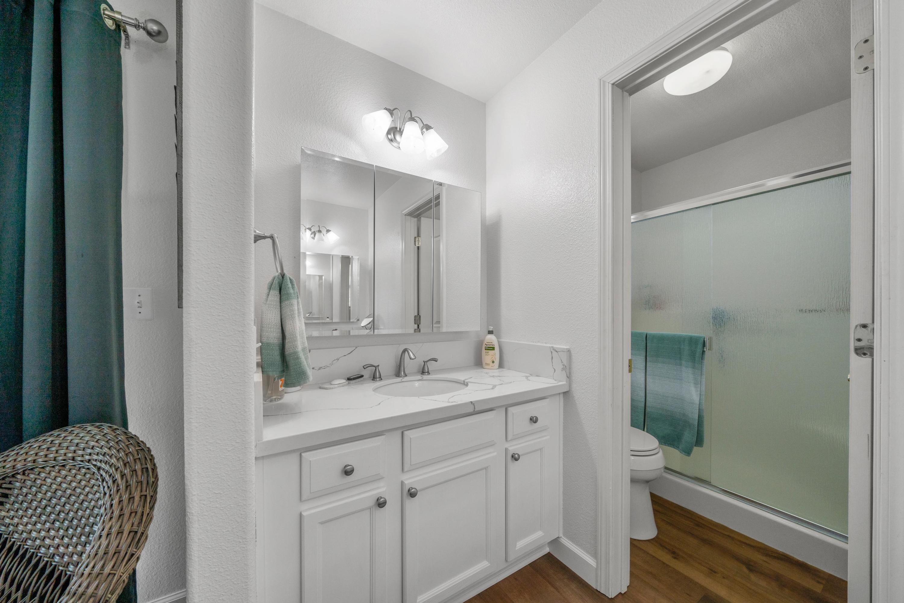 775 Stonebriar Trail Redding, CA 96003 - Photo 13 of 32 a bathroom with a sink a toilet and shower