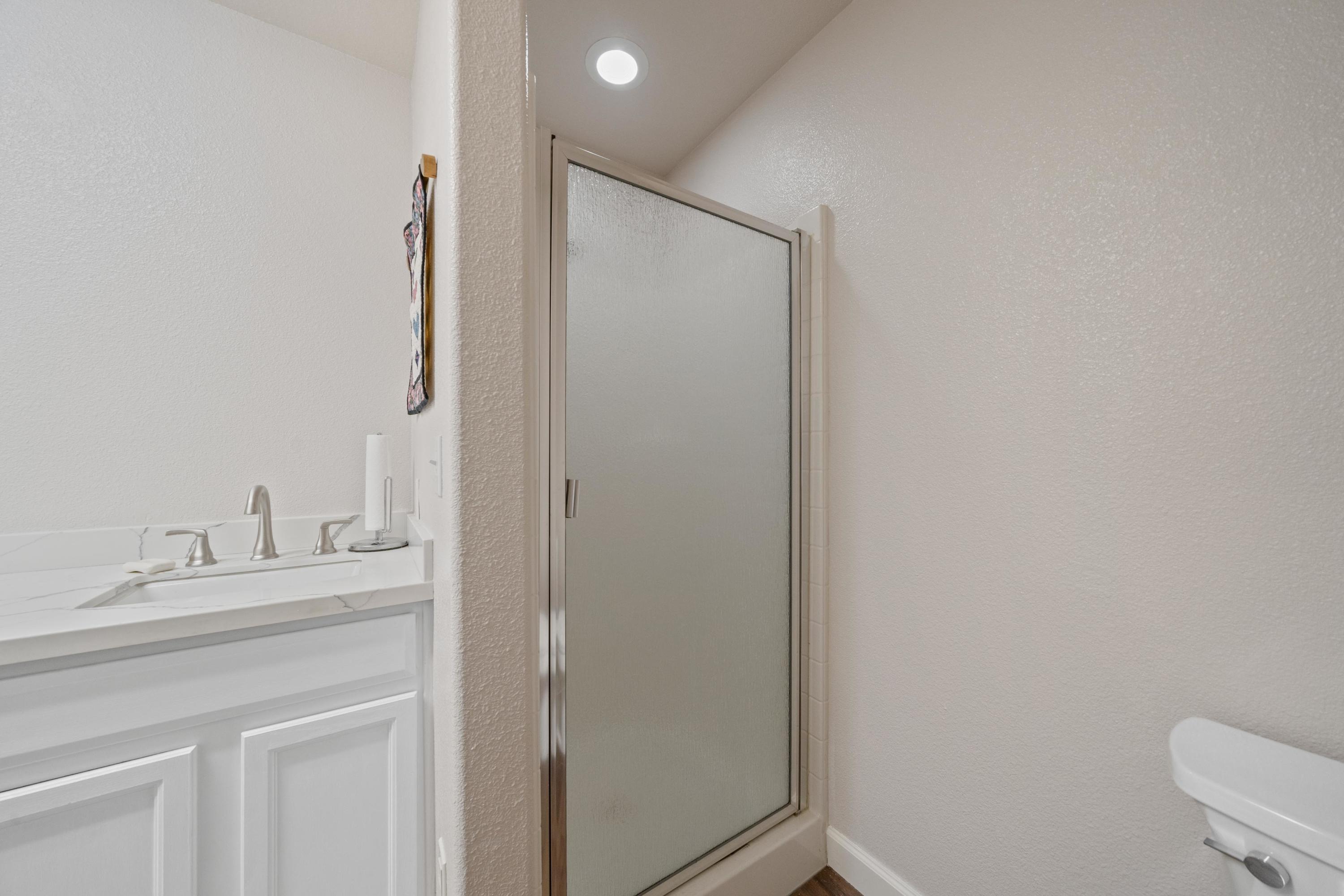 775 Stonebriar Trail Redding, CA 96003 - Photo 17 of 32 a bathroom with a sink and a mirror