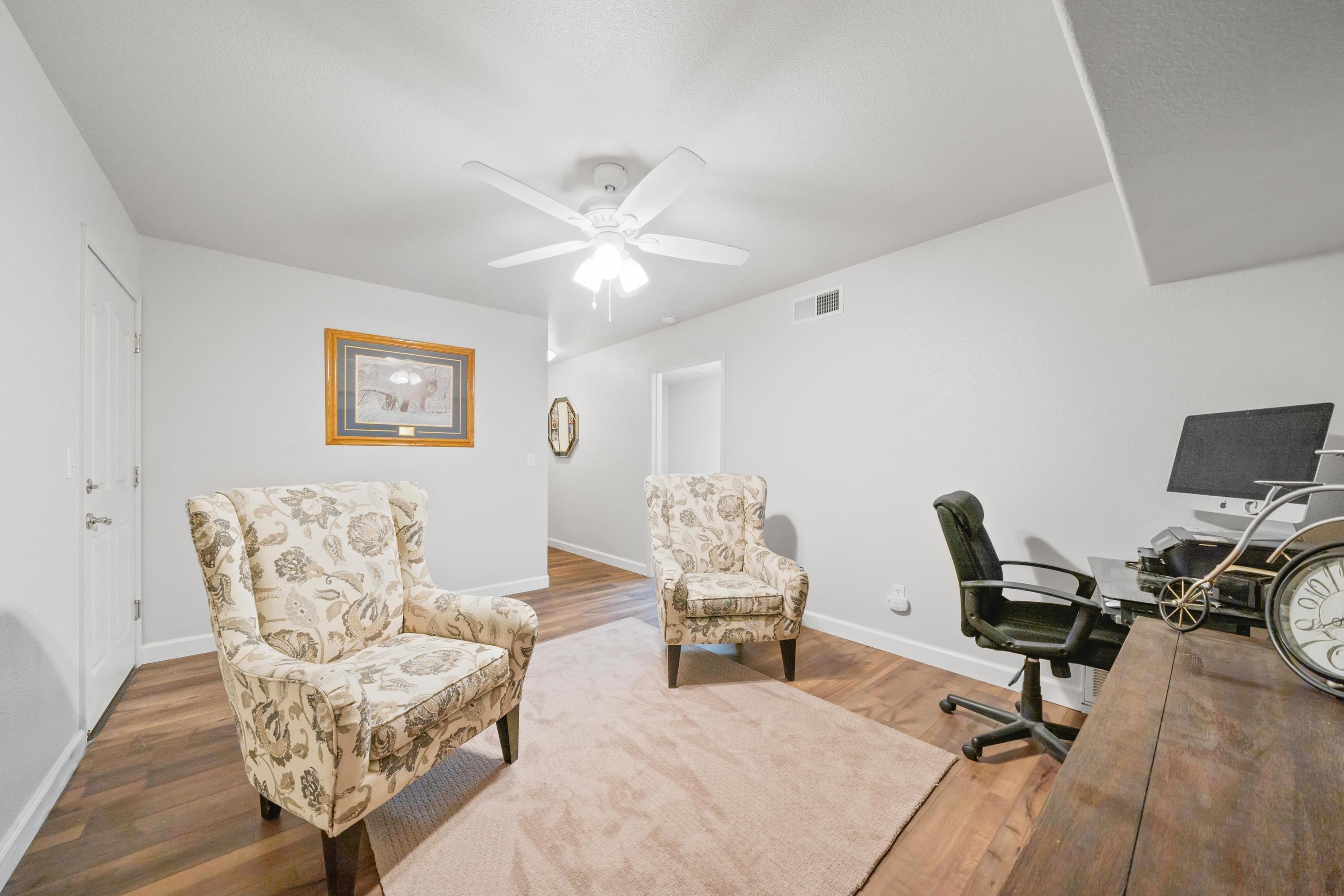 775 Stonebriar Trail Redding, CA 96003 - Photo 19 of 32 a view of a livingroom with workspace and a couch