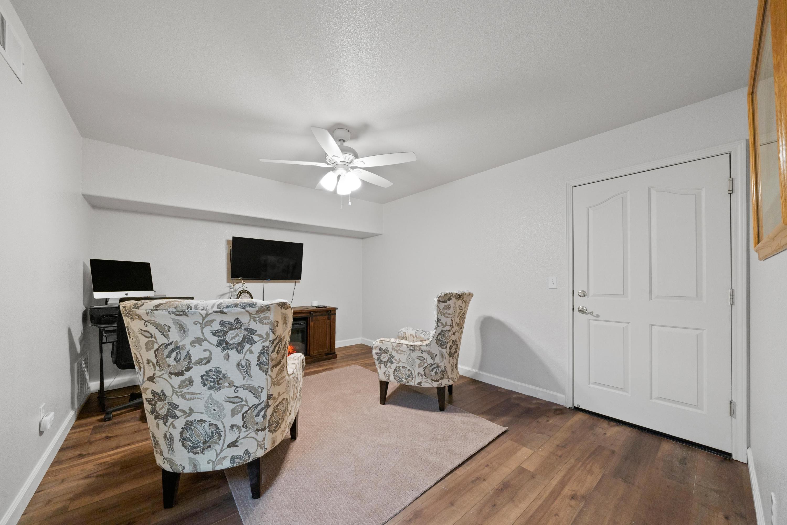 775 Stonebriar Trail Redding, CA 96003 - Photo 20 of 32 a living room with furniture and a flat screen tv