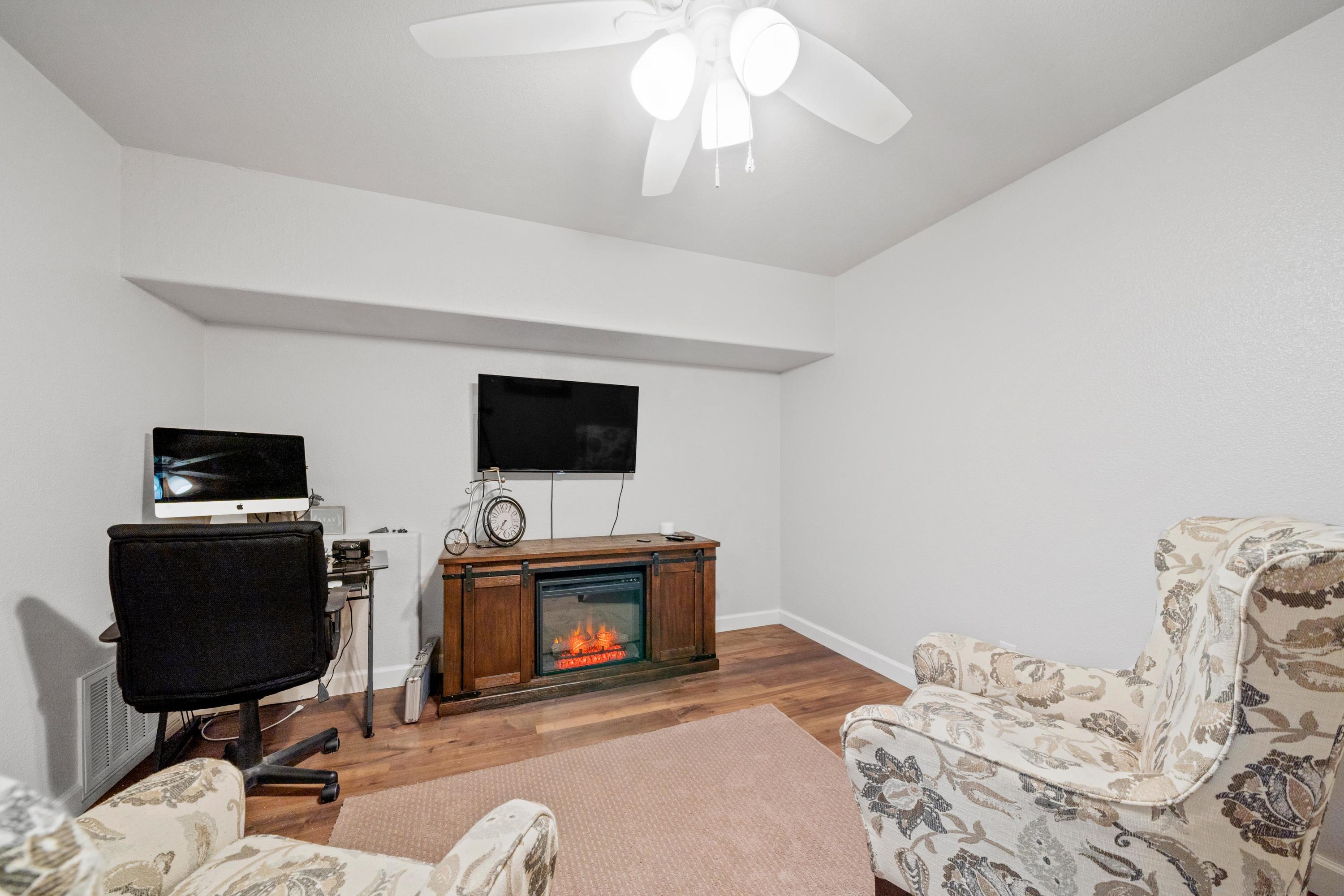 775 Stonebriar Trail Redding, CA 96003 - Photo 21 of 32 a bedroom with a bed and a television