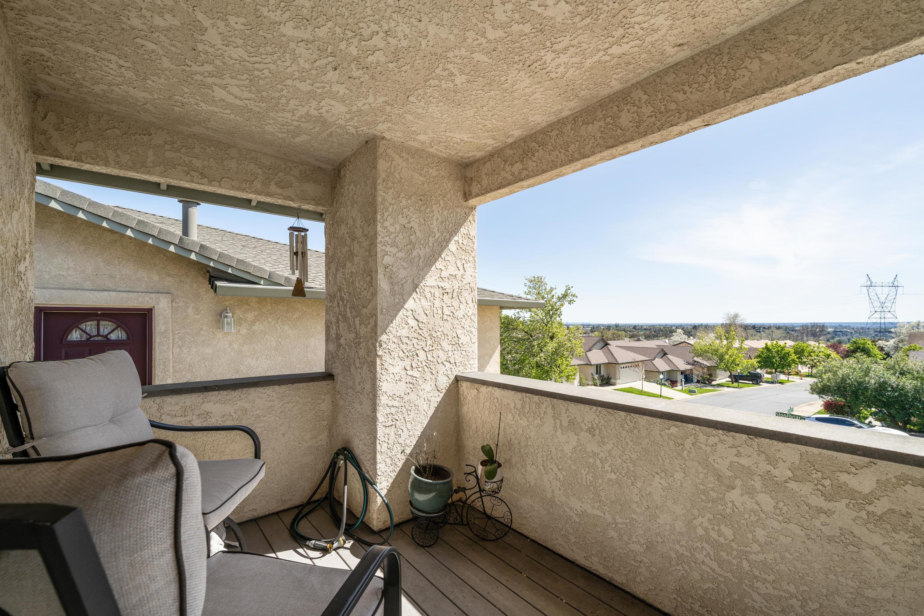 775 Stonebriar Trail Redding, CA 96003 - Photo 24 of 32 a view of a balcony with chair