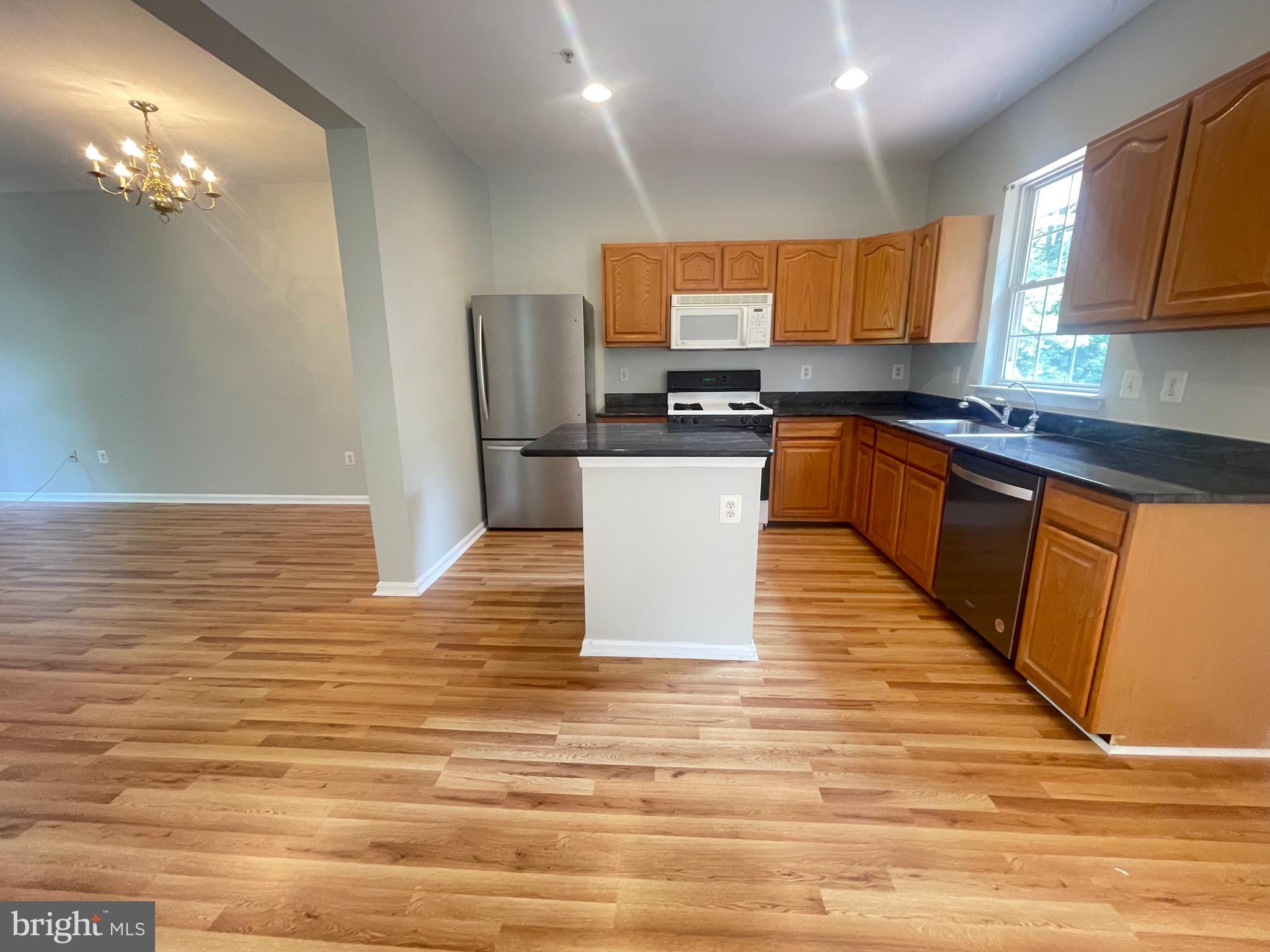 13342 Rushing Water Way Germantown, MD 20874 - Photo 2 of 33 Island kitchen with granite countertop