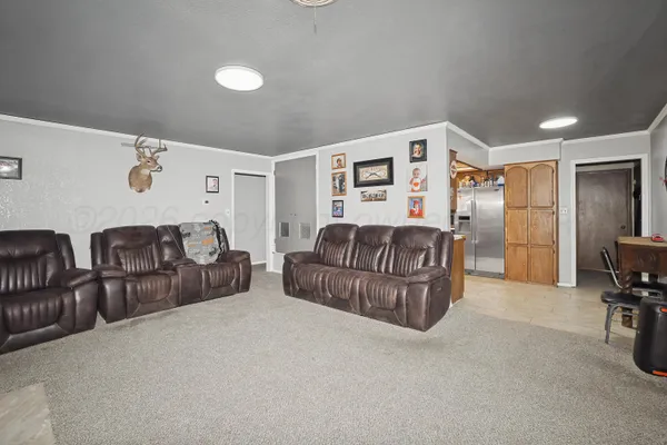 a bedroom with furniture and a rug