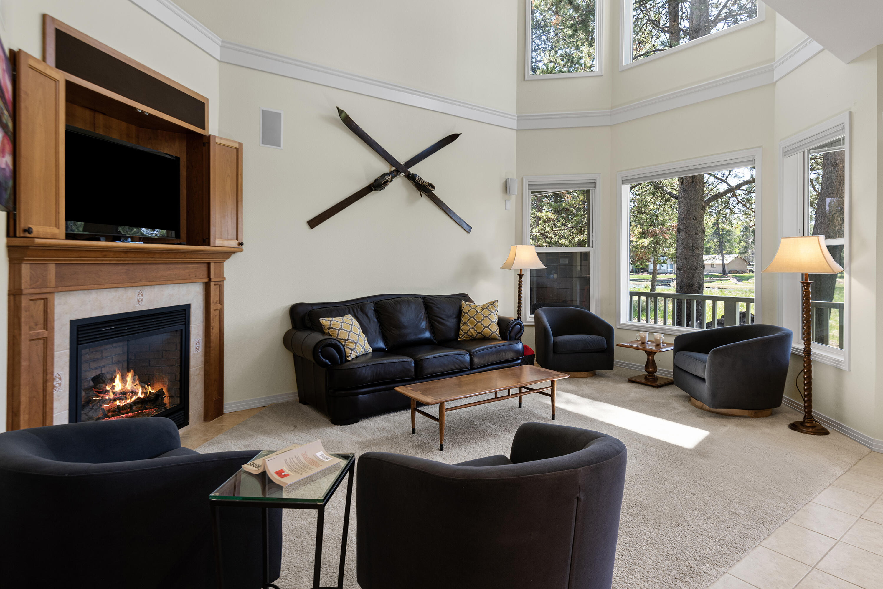 16775 Pony Express Way Bend, OR 97707 - Photo 10 of 38 a living room with furniture a flat screen tv and a fireplace