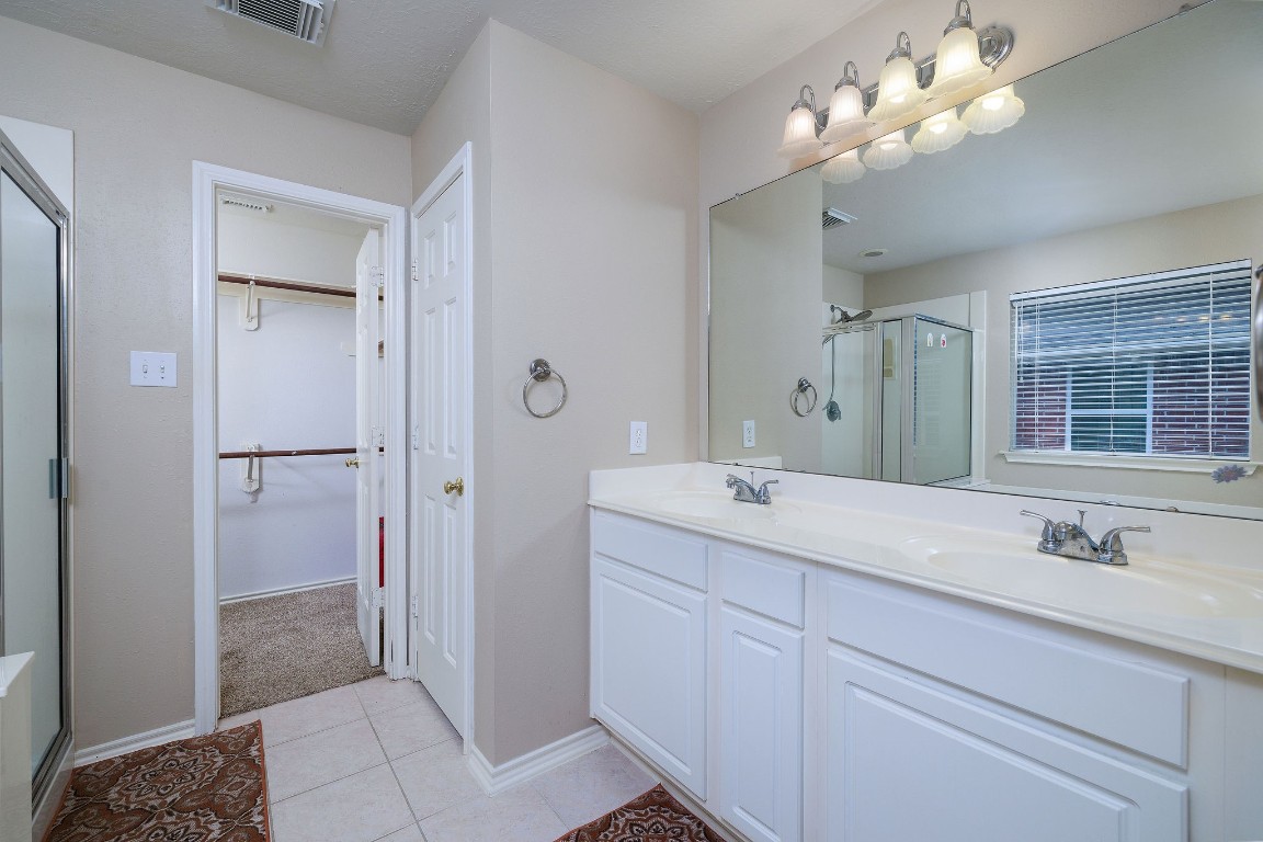 18 Tallow Hill Place Spring, TX 77382 - Photo 11 of 21 a en suite bathroom with a double vanity sink mirror and shower