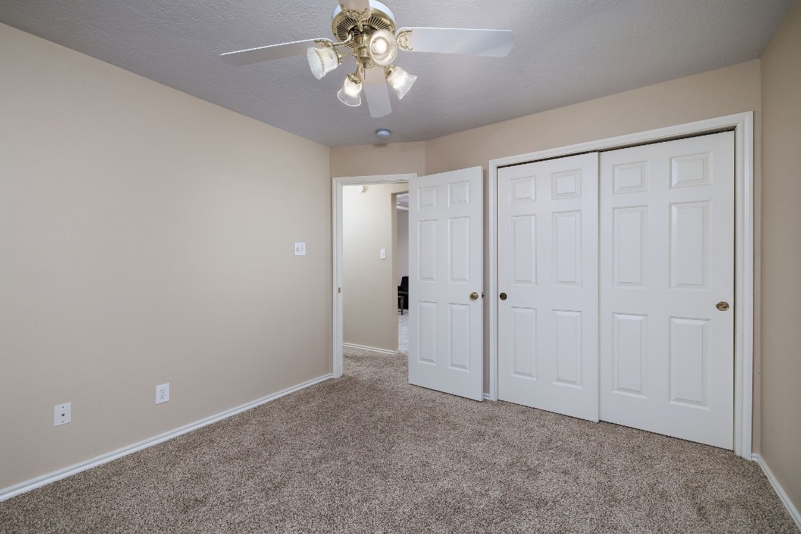 18 Tallow Hill Place Spring, TX 77382 - Photo 17 of 21 a view of an empty room and chandelier fan