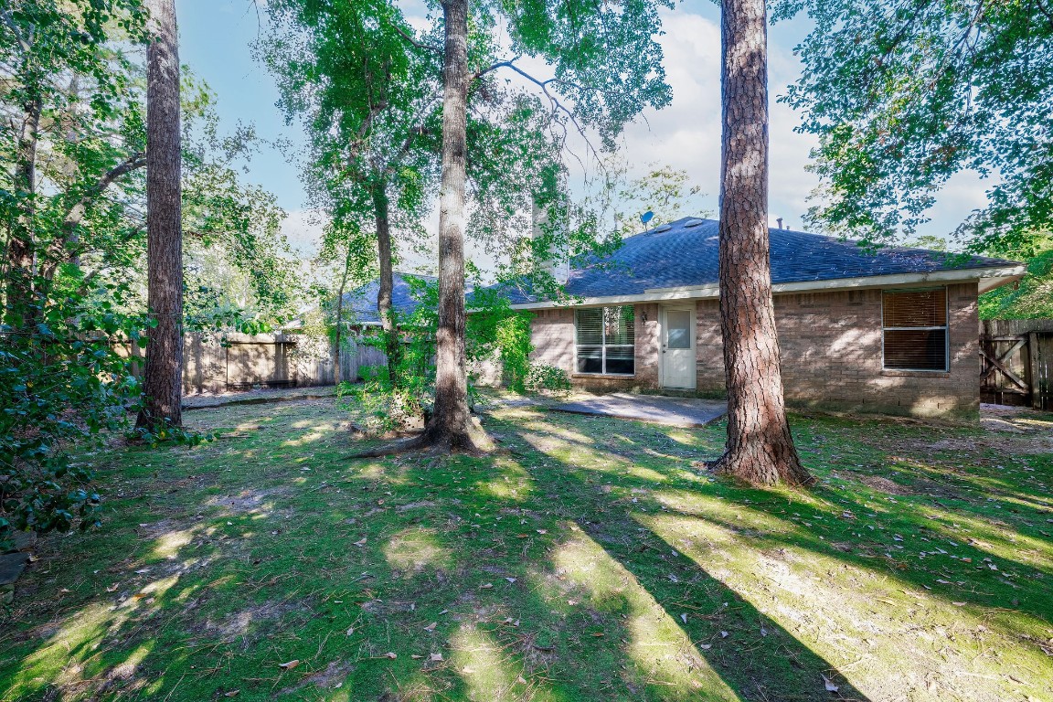 18 Tallow Hill Place Spring, TX 77382 - Photo 21 of 21 a view of a house with backyard and a tree