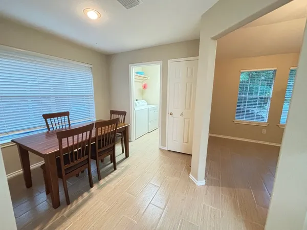 a view of a livingroom with furniture and window