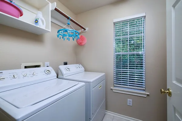 a utility room with dryer and washer