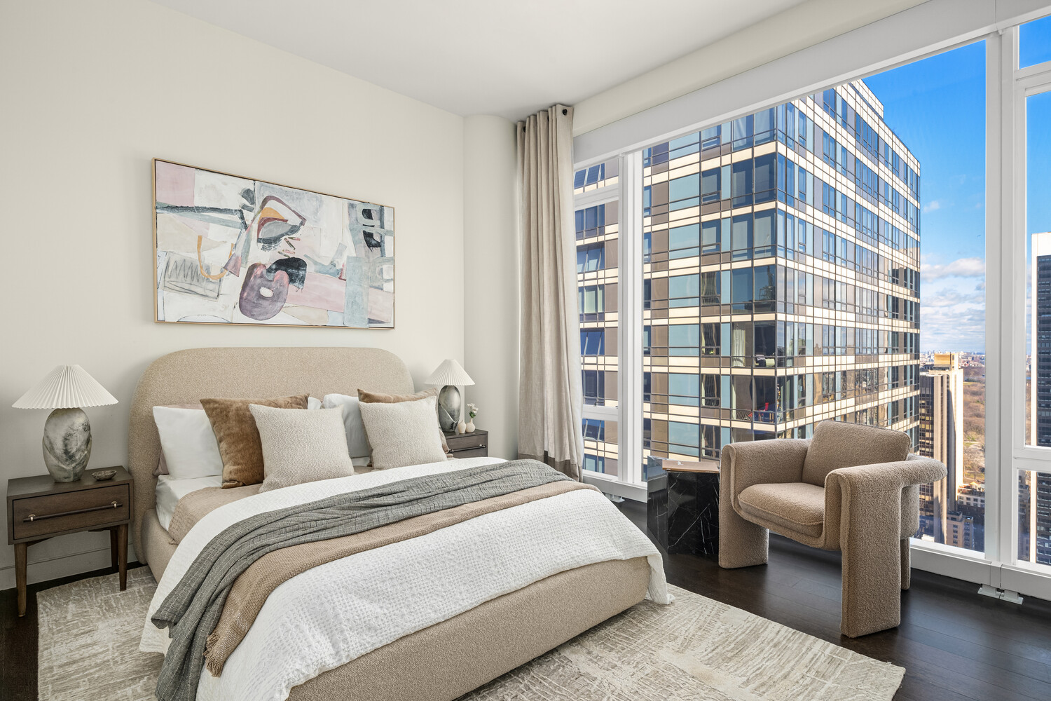 20 West 53rd Street, Unit PH43 Manhattan, NY 10019 - Photo 12 of 14 a bedroom with a bed and a couch