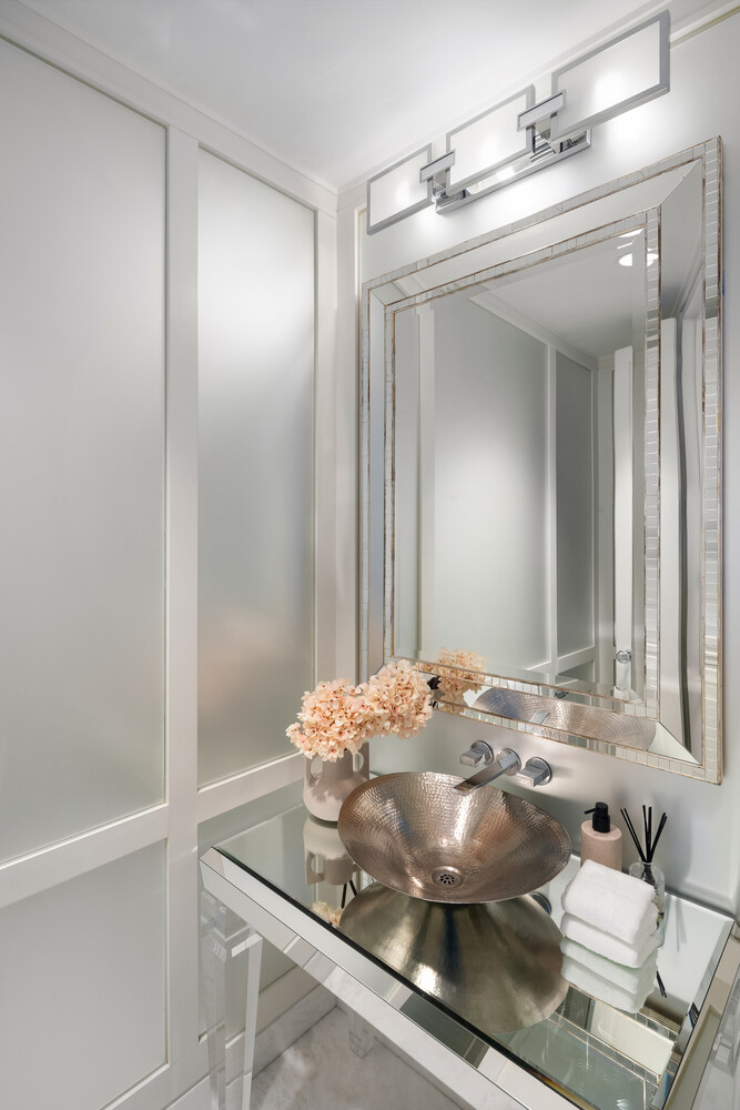 20 West 53rd Street, Unit PH43 Manhattan, NY 10019 - Photo 13 of 14 a bathroom with a sink and a mirror