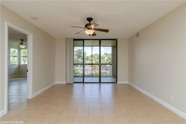 a view of an empty room with a window