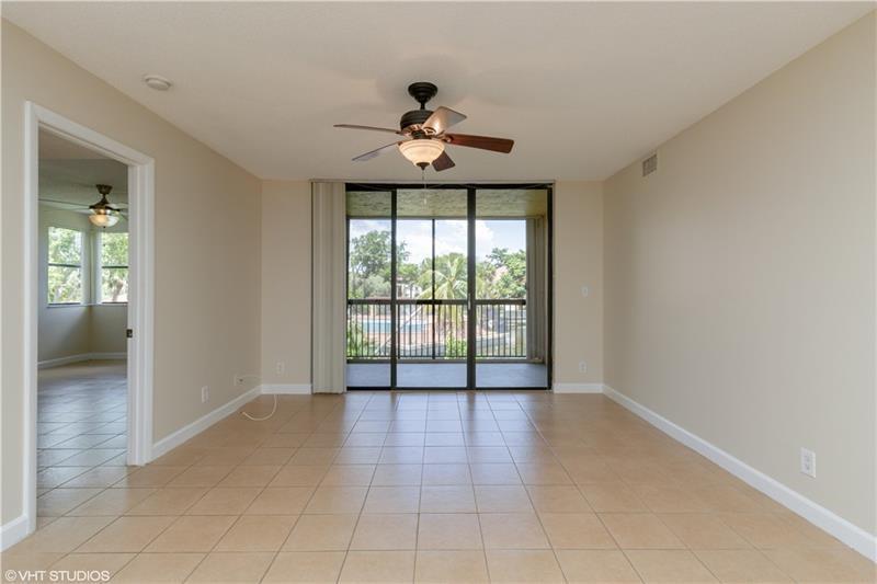 5641 Riverside Drive, Unit 202B1 Coral Springs, FL 33067 - Photo 2 of 14 a view of an empty room with a window