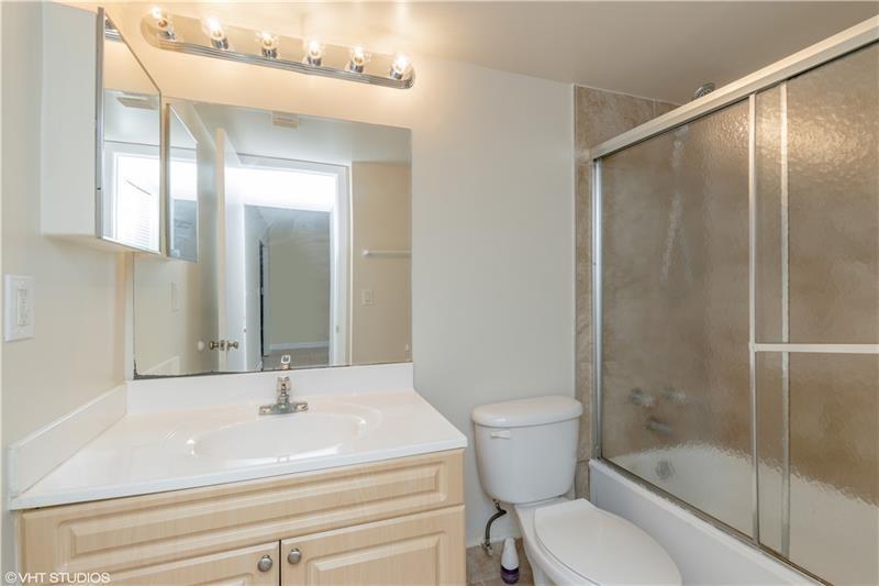 5641 Riverside Drive, Unit 202B1 Coral Springs, FL 33067 - Photo 8 of 14 a bathroom with a sink toilet and shower