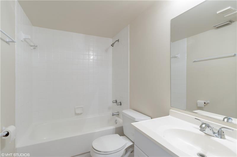 5641 Riverside Drive, Unit 202B1 Coral Springs, FL 33067 - Photo 9 of 14 a bathroom with a sink toilet and shower